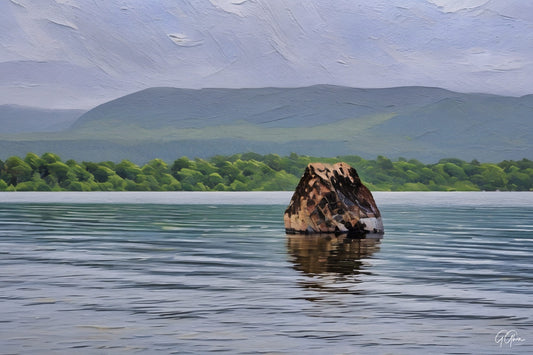 Calm loch in the Ring of Kerry, Ireland, bordered by green hills and serene water.