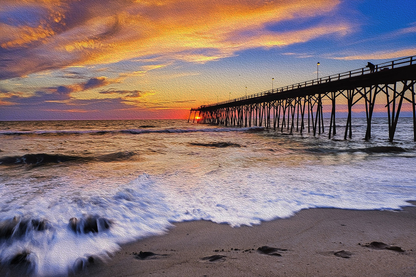 Kure Beach Fishing Pier in North Carolina stretching over the ocean, with sandy shoreline and calm coastal scenery.