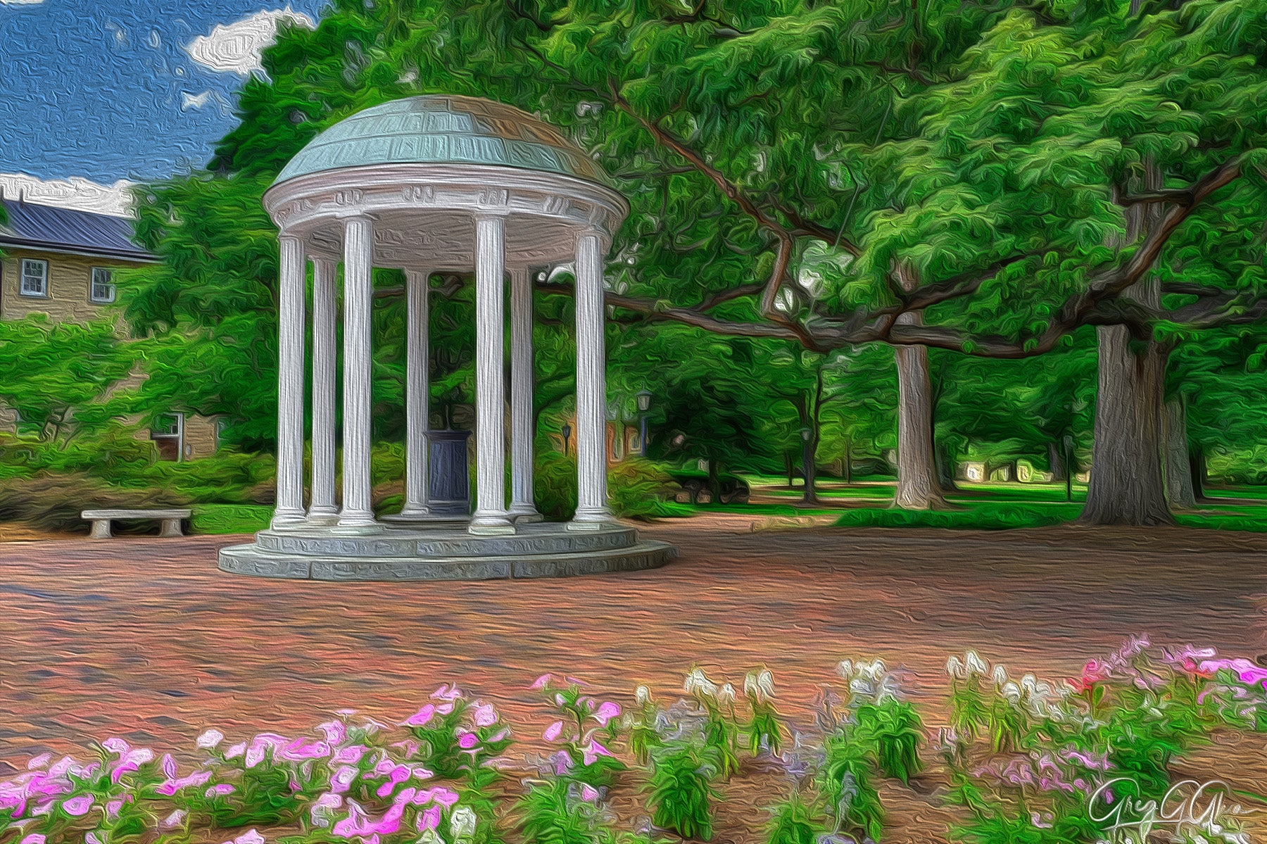 Photo of the Old Well, Chapel Hill, North Carolina, with spring flowers and brick paths under soft sunlight.